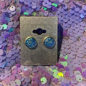 Light blue earrings.